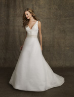 Bridal Dress: AngelinaFaccenda - 1053 - Silk Taffeta  Beaded embroidery trims the V-neckline to meet the center draped bodice with natural waistline. A-Line skirt with chapel length train. Removable Matching or Antique Sash  with Tie Back and Streamers Colors: Light Ivory 