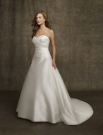 Bridal Dress: AngelinaFaccenda - 1054 - Silk Satin  Asymmetrical draping crosses over the sweetheart strapless bodice. Beading decorates the empire band onto the draped midriff with dropped waistline. ALine skirt with chapel length train. Matching Shawl Included. Colors: Light Ivory, Light Ivory/Champagne 