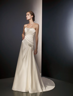 Bridal Dress: Angelina Faccenda: 1074 - Silky Satin  Jeweled beading trims the contoured, strapless neckline with asymmetrical draping cascading over the bodice to meet the softly draped, A-line skirt with a chapel length train. Color: Ivory 