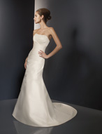 Bridal Dress: Angelina Faccenda: 1075 - Silk Shantung  Crystal beads are sprinkled over the strapless neckline with draping meeting the shirred midriff. Asymmetrical draping shapes the slim A-line skirt with a chapel length train. Color: Ivory 