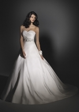 Bridal Dress: Angelina Faccenda: 1203 - Silk Shantung  The surplus, strapless bodice with soft draping meets the jeweled beading at the midriff. The natural waistline meets the ball gown skirt with side pockets and a chapel train. Colors Available: Natural* Please Note Shawls Are Not Included 