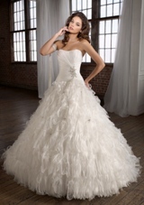 Bridal Dress: Angelina Faccenda: 1221 - Organza, Feathers, and Beading  Color: Diamond White. Available in three lengths: 55