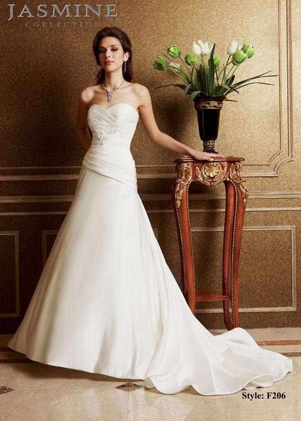 Bridal Dress: COLLECTION BRIDAL - F206  Catalogue Color:  IVORY (IV)  Silhouette:  Strapless sweetheart neckline with pleated bodice. Beaded lace applique along the empire waist.   Fabric-top layer:  ITALIAN SATIN  Accessory:  N/A  Skirt Length:  Tiffany Train  Size Range:   4-28  