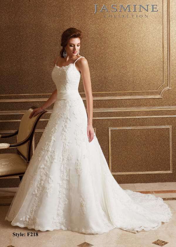 Bridal Dress: COLLECTION BRIDAL - F218  Catalogue Color:  IVORY (IV)  Silhouette:  Scoop neckline with beaded spaghetti straps. Beaded lace gown with scallop edge along the neckline and hem of skirt. Satin band at natural waist.  Fabric-top layer:  ITALIAN SATIN  Accessory:  N/A  Skirt Length:  Chapel Train  Size Range:   4-28  