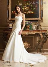 Bridal Dress: COLLECTION BRIDAL - F219  Catalogue Color:  IVORY (IV)  Silhouette:  Pleated sweetheart neckline with lace appliques. Covered buttons to end of drop waistline. Lace detailed on back train  Fabric-top layer:  TAFFETA  Accessory:  N/A  Skirt Length:  Tiffany Train  Size Range:   4-28  