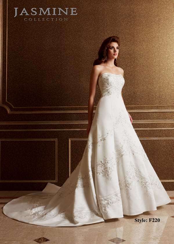 Bridal Dress: COLLECTION BRIDAL - F220  Catalogue Color:  IVORY (IV)  Silhouette:  Modified sweetheart neckline with beading and embroidery on Italian satin. Covered buttons to end of zipper  Fabric-top layer:  ITALIAN SATIN  Accessory:  N/A  Skirt Length:  Tiffany Train  Size Range:   4-28  