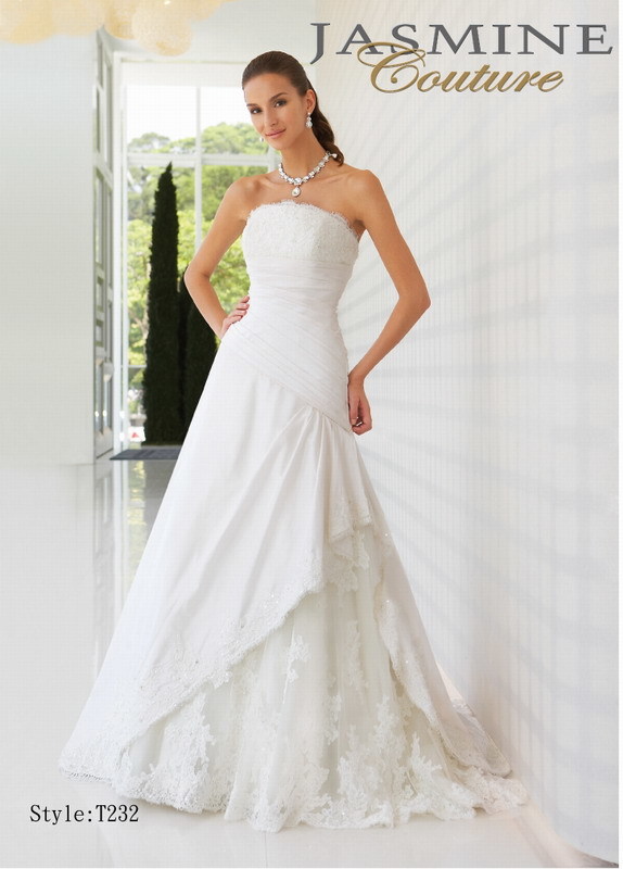 Bridal Dress: COUTURE BRIDAL - T232  Catalogue Color:  IVORY (IV)  Silhouette:  Strapless with asymmetrical drop waist. Gathered Silk taffeta dress with beaded lace top. Draped taffeta skirt with beaded lace over tulle inset.  Fabric-top layer:  SILK TAFFETA and TULLE  Accessory:  N/A  Skirt Length:  Court Train  Size Range:   4-28  