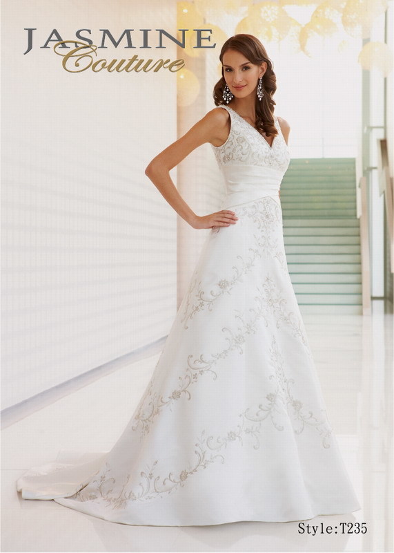 Bridal Dress: COUTURE BRIDAL - T235  Catalogue Color:  IVORY (IV)  Silhouette:  V-neck couture satin gown with gathered waist and beaded embroidery throughout.  Fabric-top layer:  COUTURE SATIN  Accessory:  N/A  Skirt Length:  Tiffany Train  Size Range:   4-28  
