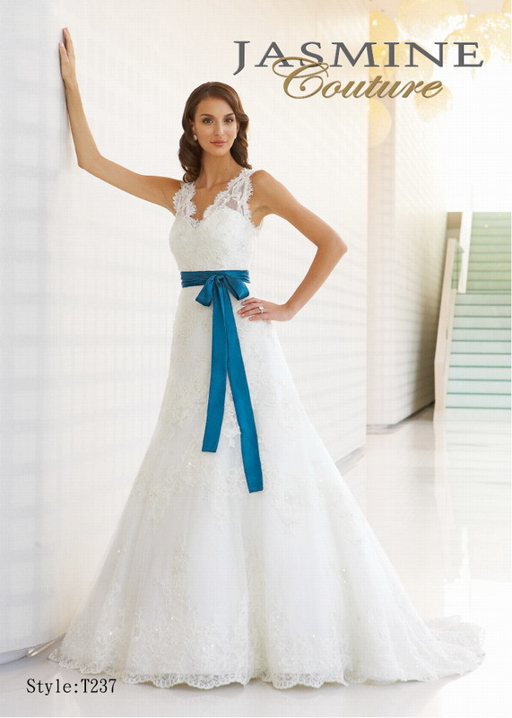 Bridal Dress: COUTURE BRIDAL - T237  Catalogue Color:  IVORY (IV)-TEAL (TL)  Silhouette:  Beaded V-neck lace gown with detachable charmeuse waistband.  Fabric-top layer:  Lace netting and CHARMEUSE  Accessory:  Waistband in accent color  Skirt Length:  Chapel Train  Size Range:   4-28  