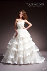 Bridal Dress: COLLECTION BRIDAL - F362  Catalogue Color:		IVORY (IV)	Fabric-top layer:		TULLE and TAFFETA	Accessory:		Beaded flower	Skirt Length:		Court train	Size Range: 		4-28 