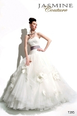 Bridal Dress: COLLECTION COUTURE - T395  Catalogue Color:		IVORY (IV) - PRALINE (RL)	Fabric-top layer:		TULLE and MATTE TAFFETA	Accessory:		Flower	Skirt Length:		Court train with Tiffany train	Size Range: 		4-28 