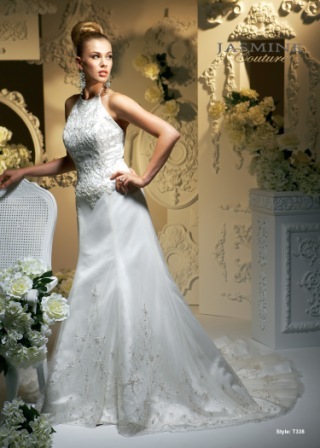 Bridal Dress: COLLECTION COUTURE - T338  Catalogue Color:		IVORY (IV)	Fabric-top layer:		SHEER NET and COUTURE SATIN	Accessory:		N/A	Skirt Length:		Tiffany Train	Size Range: 		4-28 