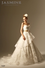 Bridal Dress: COLLECTION BRIDAL - F409  Catalogue Color:		IVORY (IV)-GOLD (GD)	Fabric-top layer:		TAFFETA, TULLE and ribbon	Accessory:		Ribbon sash	Skirt Length:		Tiffany train	Size Range: 		4-28 