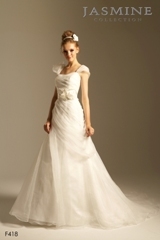 Bridal Dress: COLLECTION BRIDAL - F418  Catalogue Color:		IVORY (IV)	Fabric-top layer:		ORGANZA and ITALIAN SATIN	Accessory:		Flower sash	Skirt Length:		Chapel train	Size Range: 		4-28 