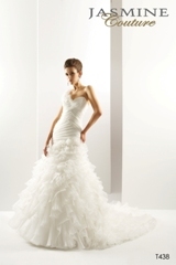 Bridal Dress: COLLECTION COUTURE - T438  Catalogue Color:		IVORY (IV)	Fabric-top layer:		LUX ORGANZA	Accessory:		Detachable flower strap	Skirt Length:		Tiffany Train	Size Range: 		4-28 