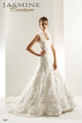 Bridal Dress: COLLECTION COUTURE - T447  Catalogue Color:		IVORY (IV)	Fabric-top layer:		TULLE and ORGANZA	Accessory:		Detachable beaded lace strap	Skirt Length:		Chapel train	Size Range: 		4-28 