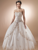 Quinceanera Dress: MoriLee - 86003  Beautiful embroidery overlays the corset seamed bodice with front lacing to meet the basque waistline.  A scalloped edging trims the split front over skirt and hemline on the ball gown skirt.  Matching bolero jacket included.
Color Availability:  Champagne/Blush, White/Pink, Lavender 