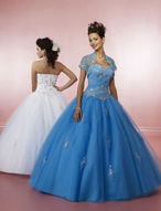 Quinceanera Dress: Quinceanera/Vizcaya: 81004 Tulle and Chi  The sweetheart, strapless bodice with beaded embroidery is trimmed with cross-over, chiffon bands at the empire. The corset tie back closure meets the full, tulle ball gown skirt. Matching bolero jacket. Color Availability: White, Ballet Pink, Peacock 