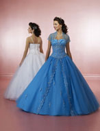 Quinceanera Dress: Quinceanera/Vizcaya: 81005 Tulle and Duc  The strapless bodice features v-shaped, draped overlay and embroidery on the midriff. Beading edges the split-front overskirt on the tulle ball gown. Matching bolero jacket. Color Availability: White, Champagne, Peacock, Watermelon 