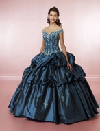 Quinceanera Dress: Quinceanera/Vizcaya: 81006 Taffeta with  This romantic gown features embroidery on the corset seamed bodice with off-the-shoulder neckline. The corset tie-back closure and modified basque waistline meet the ruched, ball gown skirt with removable flowers. Color Availability: White, Teal, Purple, Moss 