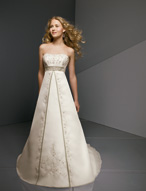 Bridal Dress: Bridals: 2225 - Embroidered Organza with  Embroidery cascades from the contoured strapless neckline to meet the empire band. Satin edges the split-front that overlays the A-line skirt with bands decorating the chapel length train. Colors: White/Silver, Pearl/Silver Trim Color Available in all Mori Lee Bridesmaid Satin Colors 