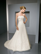 Bridal Dress: Bridals: 2302 - Duchess Satin and Organz  Softly pleated satin overlays the strapless bodice and drapes onto the empire. Embroidery cascades onto the full, A-line gown with a sparkling design surrounding the skirt and chapel length train. Available in 3 Lengths 55