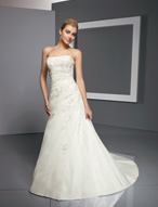 Bridal Dress: Bridals: 2303 - Radiant Taffeta with Emb  Swarovski crystals accent the embroidery on the strapless gown with asymmetrical draping over the torso and onto the A-line skirt. The corset tie back meets the draping on the chapel length train. 