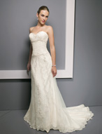 Bridal Dress: Bridals: 2304 - Tulle over Beaded Lace  Softly draped tulle overlays the beaded lace on the sweetheart strapless bodice with beaded empire and dropped waistline. Scalloped lace decorates the tulle that overlays the lace A-line skirt with chapel length train. Available in 3 Lengths 55