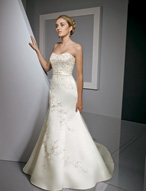 Bridal Dress: Bridals: 2305 - Duchess Satin with Embro  Sparkling embroidery decorates the sweetheart, strapless gown with fit and flare shape. A removable satin band trims the waistline with asymmetrical embroidery on the chapel length train Colors: White/Silver, Ivory/Silver, Pearl/Cafe 