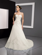 Bridal Dress: Bridals: 2306 - Delicate Chiffon with Em  Sweetheart strapless bodice has cascading embroidery and asymmetrical draping from the neckline that crosses over the waistline. Embroidery surrounds the soft, A-line skirt with the corset tie back that meets the chapel length train. Available in 3 Lengths 55