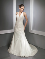 Bridal Dress: Bridals: 2310 - Luxe Taffeta with Lace  Beaded lace appliques are scattered onto the V-shaped halter bodice with asymmetrical draping from the empire over the fitted torso. The draping continues onto the A-line skirt with lace edging the hemline and chapel length train. Available in 3 Lengths 55