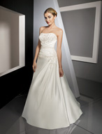 Bridal Dress: Bridals: 2311 - Duchess Satin with Embro  Elegant embroidery on the contoured strapless bodice meets the crossover draping to the dropped waistline. Asymmetrical draping cascades onto the A-line skirt with embroidery decorating the chapel length train. Removable Beaded Waistband Colors: White/Silver, Ivory/Silver 