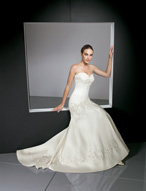 Bridal Dress: Bridals: 2312 - Duchess Satin with Embro  The mermaid gown features beaded embroidery trimming the sweetheart strapless neckline, corset tie back and dropped torso. The full, flared skirt has embroidery surrounding the hemline and chapel length train. Available in 3 Lengths 55