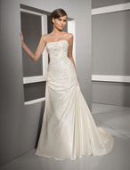 Bridal Dress: Blu: 4502 - Radiant Taffeta with Embroid  Sparkling embroidery on the strapless bodice with asymmetrical draping crossing over the empire and cascading over the torso. Crystal beaded appliques are scattered onto the draping that falls onto the A-line skirt and chapel length train. Colors: White/Silver, Ivory/Silver 