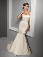 Bridal Dress: Blu: 4504 - Duchess Satin with Embroider  Crumb-catcher, strapless neckline meets the beaded embroidery on the midriff. The elegant mermaid gown has embroidery trimming the lower torso and chapel length train. Colors: White/Silver, Ivory/Silver 