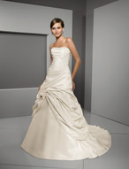 Bridal Dress: Blu: 4505 - Radiant Taffeta with Crystal  Swarovski crystals trim the strapless neckline with asymmetrical draping cascading over the bodice onto the fully swagged skirt that meets with a swirl. The corset tie back meets the chapel length train. Colors: White/Silver, Ivory/Silver 