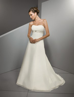 Bridal Dress: Blu: 4508 - Chiffon with Crystal Beading  Vertically shirred chiffon overlays the strapless bodice and meets the crystal beaded, empire band onto the princess line skirt, with chapel length train. Colors: White/Silver, Ivory/Silver 