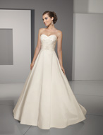 Bridal Dress: Blu: 4509 - Radiant Taffeta with Lace  Beaded lace on the sweetheart strapless bodice with draping cinched at the front waist. The modern ball gown skirt features lace appliques on the chapel length train. Colors: White, Ivory 