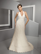 Bridal Dress: Blu: 4510 - Alencon Lace on Organza  Alencon lace gown with a V-shaped halter neckline that meets the beaded empire and A-line skirt edged with scalloped lace surrounding the hemline and chapel length train. Available in 3 Lengths 55