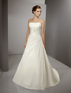 Bridal Dress: Blu: 4515 - Radiant Taffeta with Embroid  Beaded embroidery decorates the strapless neckline and meets the crossover draping on the bodice. The dropped waistline joins the softly draped, A-line skirt with chapel length train. Colors: White/Silver, Ivory/Silver 