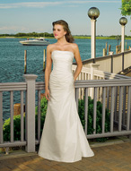 Bridal Dress: Destination/Voyage: 6306 - Luxe Taffeta  Crystal beading trims the strapless neckline on the draped torso with corset tie back on the fit and flared gown. Colors: White/Silver, Ivory/Silver 