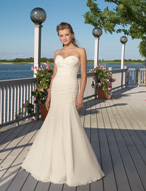 Bridal Dress: Destination/Voyage: 6308 - Delicate Chif  Intricate beading decorates the sweetheart strapless neckline that meets the draped torso with corset tie-back onto the softly flared skirt. Colors: White/Silver, Ivory/Silver 