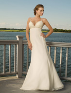 Bridal Dress: Destination/Voyage: 6309 - Silky Chiffon  Beaded straps support the plunging bodice and crisscross on the back. Beads are sprinkled over the empire onto the slim A-line gown. Colors: White/Silver, Ivory/Silver 