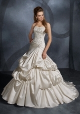 Bridal Dress: Mori Lee Bridal Collection: 2906 - Lustrous Satin with Beaded Embroidery  Elaborate embroidery with sparkling beads overlays the strapless bodice with cinched draping shaping the hips. Waterfall draping cascades onto the full skirt with an extra long chapel train. Colors Available: White/Silver, Ivory/Silver.* Please Note Shawls Are Not Included 