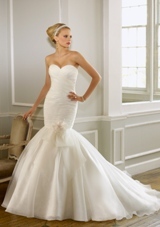 Bridal Dress: Mori Lee Bridal Collection: 1602 - Organza over Chantilly Lace  Removable bow with flower. Colors: White, Ivory, Cream. Sizes Available: 2-28. Available in three lengths 55