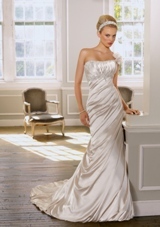 Bridal Dress: Mori Lee Bridal Collection: 1605 - Soft Satin with embroidery  Removable beaded one shoulder strap with flowers. Colors: White/Silver, Ivory/Silver, Light Gold. Sizes Available: 2-28.  