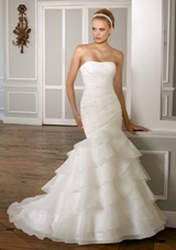 Bridal Dress: Mori Lee Bridal Collection: 1606 - Beaded Organza  Removable one shoulder strap. Colors: White, Ivory. Sizes Available 2-28. Available in three lengths: 55