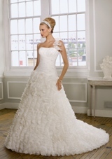 Bridal Dress: Mori Lee Bridal Collection: 1610 - Ruffled Organza with beading  Removable ruffled one shoulder strap. Colors: White, Ivory. Sizes Available: 2-28. Available in three lenghts: 55