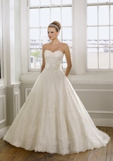 Bridal Dress: Mori Lee Bridal Collection: 1612 - Embroidered Lace on Net  Waist Sash with Flower. Colors: White, Ivory, Ivory/Champagne. Sizes Available: 2-28. Available in three lengths: 55