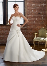 Bridal Dress: Mori Lee Blue Collection: 4812 - Lustrous Satin with embroidery  Removable flower and bow. Colors: White/Silver, Ivory/Silver. Sizes Available: 2-28. 